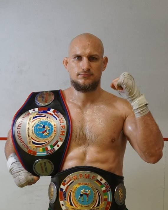Tobias Alexandersson with his WPMF Muay Thai champion belts