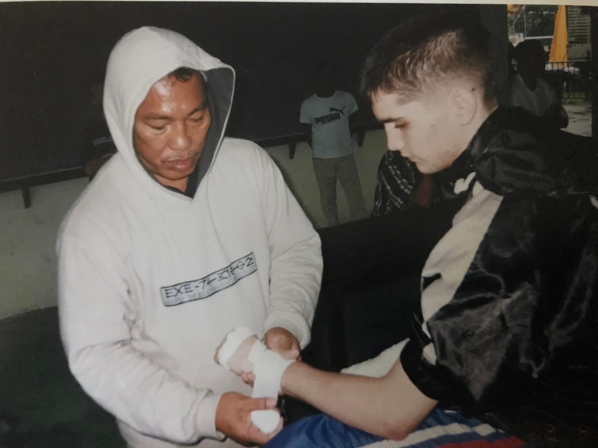 Mr Pek wrapping Danny's hands before a fight, early 2000s